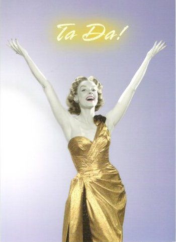 This girl is very excited about Beeminder premium a woman in a gold/yellow dress exclaiming 'tada'